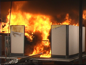 Photograph of the burning of a typical office workstation.