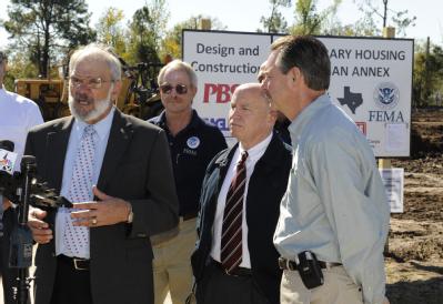 Orange, TX, November 25, 2008 -- Local officials and FEMA representatives speak to a gathered crowd during a ground breaking ceremony. Left to rig...