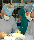 Volunteer Dr. Keith Rose instructs Afghan surgeons in the latest burn care treatments at the CURE Hospital in Kabul, Afghanistan.