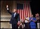 President George W. Bush waves to the crowd during his introduction at the Stockton Memorial Auditorium in Stockton, Calif., Friday, Aug. 23.  