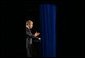 Photographed through stage curtains, President George W. Bush delivers his remarks on compassionate Conservatism at Parkside Hall in San Jose, Ca., Tuesday, April 30.  White House photo by Eric Draper.