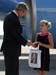 President George W. Bush met Alexandra Amend upon arrival in Cincinnati, Ohio, on Monday, August 16, 2004.  Amend, 10, raises money for charitable organizations by playing her violin in public places in Cincinnati. 