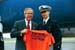 President George W. Bush met U.S. Coast Guard Academy third class cadet Greg Ponzi upon arrival in New London, Connecticut, on Wednesday, May 21, 2003. Ponzi volunteers in the New London area and helps fellow cadets find volunteer opportunities.