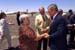 President George W. Bush met Ophelia Chaffino upon arrival in Las Cruces, New Mexico tomorrow, Saturday, August 24, 2002. Chaffino tutors 4th and 5th grade students as a volunteer with the Foster Grandparents program. 