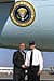 President George W. Bush met Dean Claussen upon arrival in Davenport, Iowa, on Monday, September 16, 2002. Claussen is a high school junior who works with other young people to help those in need through the Scott County 4-H Council. 