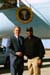 President George W. Bush met U.S. Navy Senior Chief Arden Battle upon arrival in Jacksonville, Florida, on Thursday, February 13, 2003. Battle, currently assigned to the USS John F. Kennedy, volunteers approximately 20 hours each month helping community organizations. 