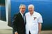 President George W. Bush met Scotty Maconochie upon arrival in Detroit, Michigan, on Wednesday, July 7, 2004. Maconochie, a World War II veteran, is a volunteer motivational speaker at the Oakland County Sheriff's Office Boot Camp.