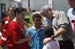 President George W. Bush comforts a family displaced by recent flooding during his visit Thursday, June 19, 2008, to a Red Cross shelter in Iowa City, Iowa.