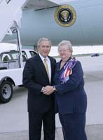 President George W. Bush presented the President’s Volunteer Service Award to Mary Nelson Adams upon arrival at the airport in Savannah, Georgia, on Thursday, September 7, 2006.  Adams is a volunteer with United Service Organizations (USO) Georgia.  To thank them for making a difference in the lives of others, President Bush honors a local volunteer, called a USA Freedom Corps Greeter, when he travels throughout the United States.  President Bush has met with more than 500 individuals around the country, like Adams, since March 2002.