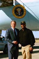 President George W. Bush met U.S. Navy Senior Chief Arden Battle upon arrival in Jacksonville, Florida, on Thursday, February 13, 2003. Battle, currently assigned to the USS John F. Kennedy, volunteers approximately 20 hours each month helping community organizations. 
