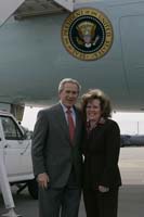 President George W. Bush presented the President’s Volunteer Service Award to Suzanne Bingham upon arrival at the airport in Nashville, Tennessee, on Wednesday, February 1, 2006.  Bingham is a volunteer with Junior Achievement of Middle Tennessee.  To thank them for making a difference in the lives of others, President Bush has met with more than 460 individuals around the country, like Bingham, since March 2002.