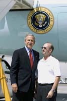 President George W. Bush met Mike Peschl upon arrival in Las Vegas, Nevada, on Thursday, August 12, 2004.  Peschl is an active volunteer with Habitat for Humanity. 