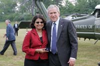 President George W. Bush presented the President’s Volunteer Service Award to Devy Goradia upon arrival in Charlottesville, Virginia, on Friday, July 4, 2008.  Goradia is a volunteer with the Charlottesville Regional Chamber of Commerce, SCORE, the Small Business Development Center and Shelter for Help in Emergency.  To thank them for making a difference in the lives of others, President Bush honors a local volunteer when he travels throughout the United States.  He has met with more than 600 volunteers, like Goradia, since March 2002.