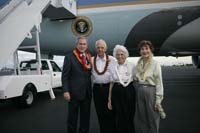 President George W. Bush presented the President’s Volunteer Service Award to Eloise Monsarrat upon arrival at the airport in Honolulu, Hawaii, on Monday, November, 20, 2006.  Monsarrat is a volunteer with the Human Animal Bond Program at Tripler Army Medical Center.  To thank them for making a difference in the lives of others, President Bush honors a local volunteer, called a USA Freedom Corps Greeter, when he travels throughout the United States.  President Bush has met with more than 550 individuals around the country, like Monsarrat, since March 2002.
