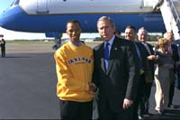 President George W. Bush met Lenwood Compton upon arrival at Oakland County International Airport on Monday, October 14. As a second year member of AmeriCorps, Compton tutors children in grades 1 through 3. 