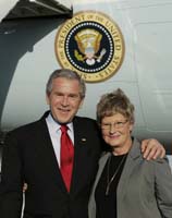 President George W. Bush presented the President’s Volunteer Service Award to Pat McWaters upon arrival at Ellington Field in Houston, Texas, on Monday, October 30, 2006.  McWaters is a volunteer at the Second Mile Mission Center.  To thank them for making a difference in the lives of others, President Bush honors a local volunteer, called a USA Freedom Corps Greeter, when he travels throughout the United States.  President Bush has met with more than 550 individuals around the country, like McWaters, since March 2002.