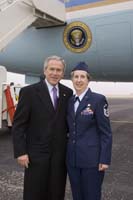 President George W. Bush presented the President’s Volunteer Service Award to Janet Dunn upon arrival in Topeka, Kansas, on Monday, January 23, 2006. Dunn, a master sergeant in the Kansas Air National Guard, is a volunteer with the Wing Family Program Office at Forbes Field Air Guard Station. To thank them for making a difference in the lives of others, President Bush has met with more than 460 individuals around the country, like Dunn, since March 2002. 