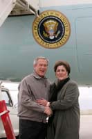 President George W. Bush met Linda Peterson upon arrival in Cedar Rapids, Iowa, on Friday, October 15, 2004.  Peterson is an active volunteer with several community organizations in Cedar Rapids, including the annual Variety Children’s Charity of Iowa telethon.