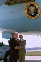 President George W. Bush met Herbert S. Anderson upon arrival in Dearborn, Michigan, on Monday, April 28, 2003. Anderson is a “Foster Grandparent” working with students, teachers, and administrators at the Greenfield Union Elementary School in Detroit. 