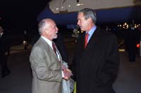 President George W. Bush met John Wells, Jr., upon arrival in Charleston, West Virginia, on Thursday, October 31. Wells has been an active volunteer with the Charleston YMCA for more than 30 years. 