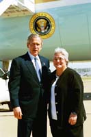 President George W. Bush met Dr. Joann Sanders upon arrival in Dallas, Texas, on Monday, March 8, 2004.  Sanders volunteers each summer at Camp John Marc, a special camp for children with serious illnesses and physical disabilities.