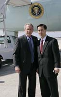 President George W. Bush presented the President’s Volunteer Service Award to Joe MacDougald II upon arrival at the airport in Tampa, Florida, on Friday, February 17, 2006.  MacDougald is a volunteer with the Special Operations Warrior Foundation.  To thank them for making a difference in the lives of others, President Bush has met with more than 470 individuals around the country, like MacDougald, since March 2002.