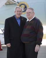 President George W. Bush presented the President’s Volunteer Service Award to Earl Belt upon arrival at the airport in Sioux City, Iowa, on Friday, November 3, 2006.  Belt is a volunteer with the Retired and Senior Volunteer Program.  To thank them for making a difference in the lives of others, President Bush honors a local volunteer, called a USA Freedom Corps Greeter, when he travels throughout the United States.  President Bush has met with more than 550 individuals around the country, like Belt, since March 2002.