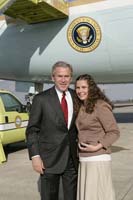 President George W. Bush presented the President’s Volunteer Service Award to Shauna Clark, 18, upon arrival at the airport in Orlando, Florida, on Friday, February 17, 2006.  Clark is a volunteer with the Timber Creek High School Service Learning Academy.  To thank them for making a difference in the lives of others, President Bush has met with more than 470 individuals around the country, like Clark, since March 2002.