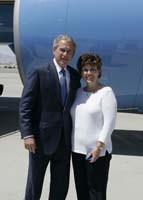 President George W. Bush presented the President’s Volunteer Service Award to Patty Murphy upon arrival at the airport in Las Vegas Nevada, on Monday, April 24, 2006.  Murphy volunteers with the Medical Reserve Corps of Clark County.  To thank them for making a difference in the lives of others, President Bush has met with more than 490 individuals around the country, like Murphy, since March 2002.