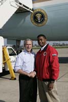 President George W. Bush presented the President’s Volunteer Service Award to Theo Richards upon arrival in New Orleans, Louisiana, on Wednesday, March 8, 2006.  Richards, 20, is a volunteer with City Year Louisiana. To thank them for making a difference in the lives of others, President Bush has met with more than 475 individuals around the country, like Richards, since March 2002.