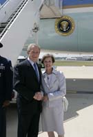 President George W. Bush presented the President’s Volunteer Service Award to Susan Reese upon arrival at the airport in St. Louis, Missouri, on Wednesday, June 28, 2006.  Reese is a volunteer with St. Patrick Center.  To thank them for making a difference in the lives of others, President Bush honors a local volunteer, called a USA Freedom Corps greeter, when he travels throughout the United States.  President Bush has met with more than 500 individuals around the country, like Reese, since March 2002.