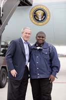 President George W. Bush presented the President’s Volunteer Service Award to Eugene Goss, 17, upon arrival at the airport in Erlanger, Kentucky, on Monday, April 3, 2006.  Goss, a junior at Clark Montessori Junior and Senior High School, is a volunteer with Keep Cincinnati Beautiful.  To thank them for making a difference in the lives of others, President Bush has met with more than 480 individuals around the country, like Goss, since March 2002.