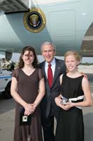 President George W. Bush presented the President’s Volunteer Service Award to Molly and Carly Houlahan, ages 15 and 13, upon arrival in Philadelphia, Pennsylvania, on Thursday, July 26, 2007.  The sisters are co-founders of the non-profit company Hives for Lives.  To thank them for making a difference in the lives of others, President Bush honors local volunteers when he travels throughout the United States.  President Bush has met with more than 575 individuals around the country, like Molly and Carly, since March 2002.