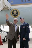 President George W. Bush presented the President’s Volunteer Service Award to Brian Webster upon arrival at Buckley Air Force Base on Friday, July 21, 2006.  Webster, a technical sergeant stationed at the base, is a volunteer with Hearts Across The Miles.  To thank them for making a difference in the lives of others, President Bush honors a local volunteer, called a USA Freedom Corps greeter, when he travels throughout the United States.  President Bush has met with more than 500 individuals around the country, like Webster, since March 2002.