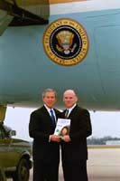 President George W. Bush met Dr. Michael Quick upon arrival in Little Rock, Arkansas, on Monday, November 10, 2003.  Quick, an orthodontist in North Little Rock, volunteers with Donated Dental Services. 