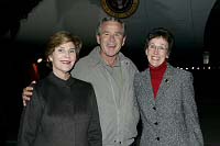President George W. Bush met Sue Stuempel upon arrival at the Cincinnati/Northern Kentucky International Airport, on Sunday, October 31, 2004.  Stuempel and her dog, Daisy, have been pet therapy volunteers with several organizations in Cincinnati.