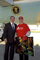 President George W. Bush met Thom Ricks upon arrival in San Antonio, Texas on Thursday, October 30, 2003.  Ricks has been an active volunteer with Rebuilding Together for nearly ten years.