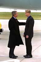 President George W. Bush met Nicklaus Reichel upon arrival in Rochester, Minnesota, on Friday, October 18, 2002. As part of the Summer of Service youth program, 15 year-old Reichel has volunteered more than 400 hours in service to his community. 