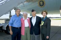 President George W. Bush met Ken Porwoll upon arrival in St. Paul, Minnesota, on Saturday, October 9, 2004.  Porwoll, 84, is a World War II veteran and an active volunteer with the Veterans Affairs Medical Center (VAMC) in Minneapolis.