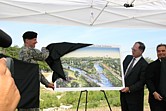 John Paul Woodley, Jr., Assistant Secretary of the Army (Civil Works) and Maj. Gen. Don T. Riley, Director of Civil Works, U.S. Army Corps of Engineers unveil artist renditions of a portion the San Antonio River Improvements Project in San Antonio, Texas Sept. 7 during a media event.