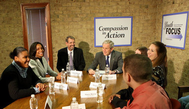 President George W. Bush participates in a roundtable on mentoring children of prisoners initiative Tuesday, Dec. 2, 2008, at the Youth Focus, Inc., in Greensboro, N.C., where President Bush praised the Youth Focus program for their work in helping youngsters toward a brighter future. White House photo by Chris Greenberg.
