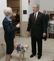 President George W. Bush talks with Citizen Corps volunteer before appearing at the United States Chamber of Commerce to deliver remarks on Thursday, June 1, 2006.  