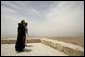 Laura Bush and Father Michele Piccirillo, head of the Franciscan Archeology Society, look out from the Judeo-Christian holy site of Mount Nebo in Jordan Saturday, May 21, 2005. White House photo by Krisanne Johnson