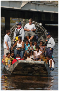 Residents are evacuated from their homes by a FEMA Urban Search and Rescue team from Florida. New Orleans is being evacuated as a result of floods caused by hurricane Katrina. Photo by Jocelyn Augustino/FEMA