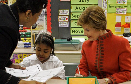 Mrs. Bush with young student and teacher at Washington Elementary School