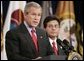 Attorney General Alberto Gonzales looks on as President Bush delivers remarks Monday, Feb. 14, 2005, during Mr. Gonzales's ceremonial swearing in.  White House photo by Paul Morse