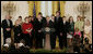 President George W. Bush, joined by military family members, addresses his remarks on the Iraq War supplemental spending bill in the East Room at the White House, Monday, April 16, 2007. President Bush urged Congress to pass an emergency war spending bill, without strings and without further delay.  White House photo by Joyce N. Boghosian