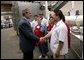 President George W. Bush greets employees of Andrea Foods in Orange, N.J., Monday, June 16, 2003.  White House photo by Eric Draper