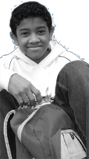 Photo of pre-teen African American boy grinning with backpack
