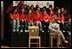 Laura Bush talks with middle school students on stage prior to delivering remarks at Sun Valley Middle School in Sun Valley, Calif., April 27, 2005.